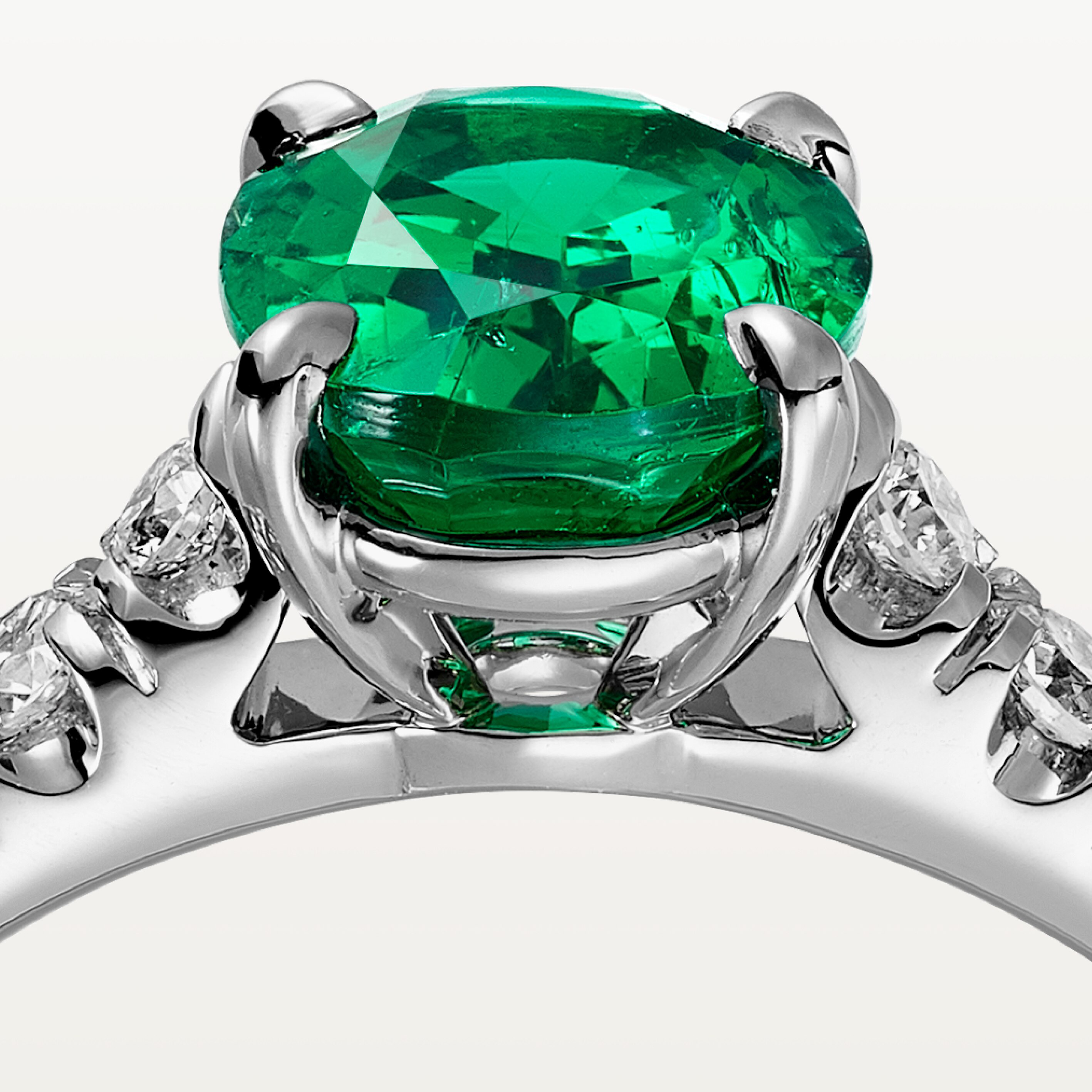 1895 solitaire, oval-cut emerald, paved 