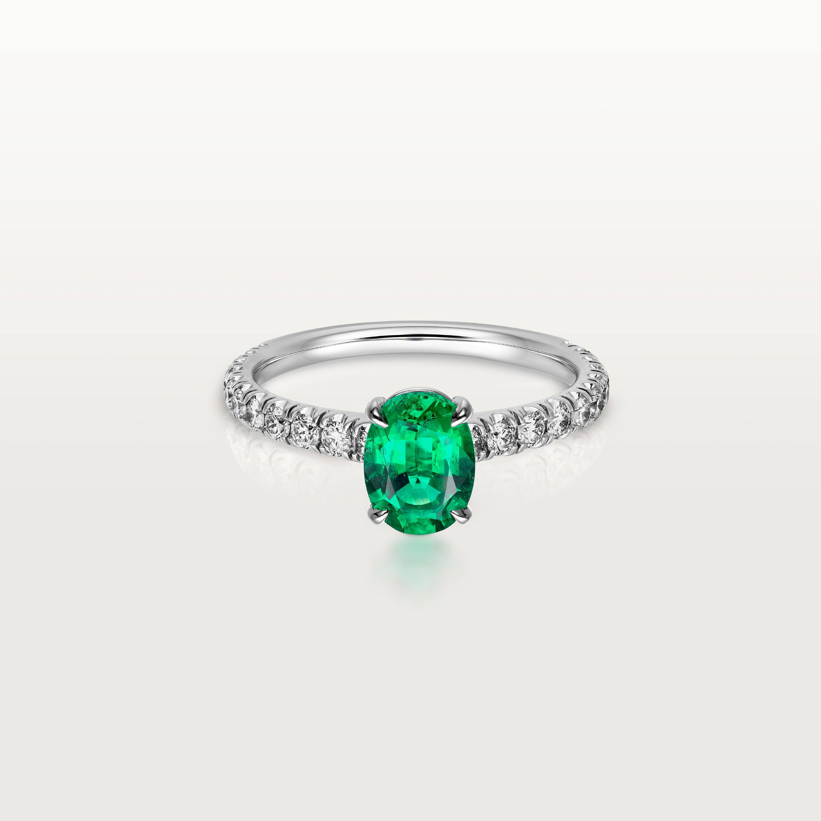 1895 solitaire, oval-cut emerald, paved 