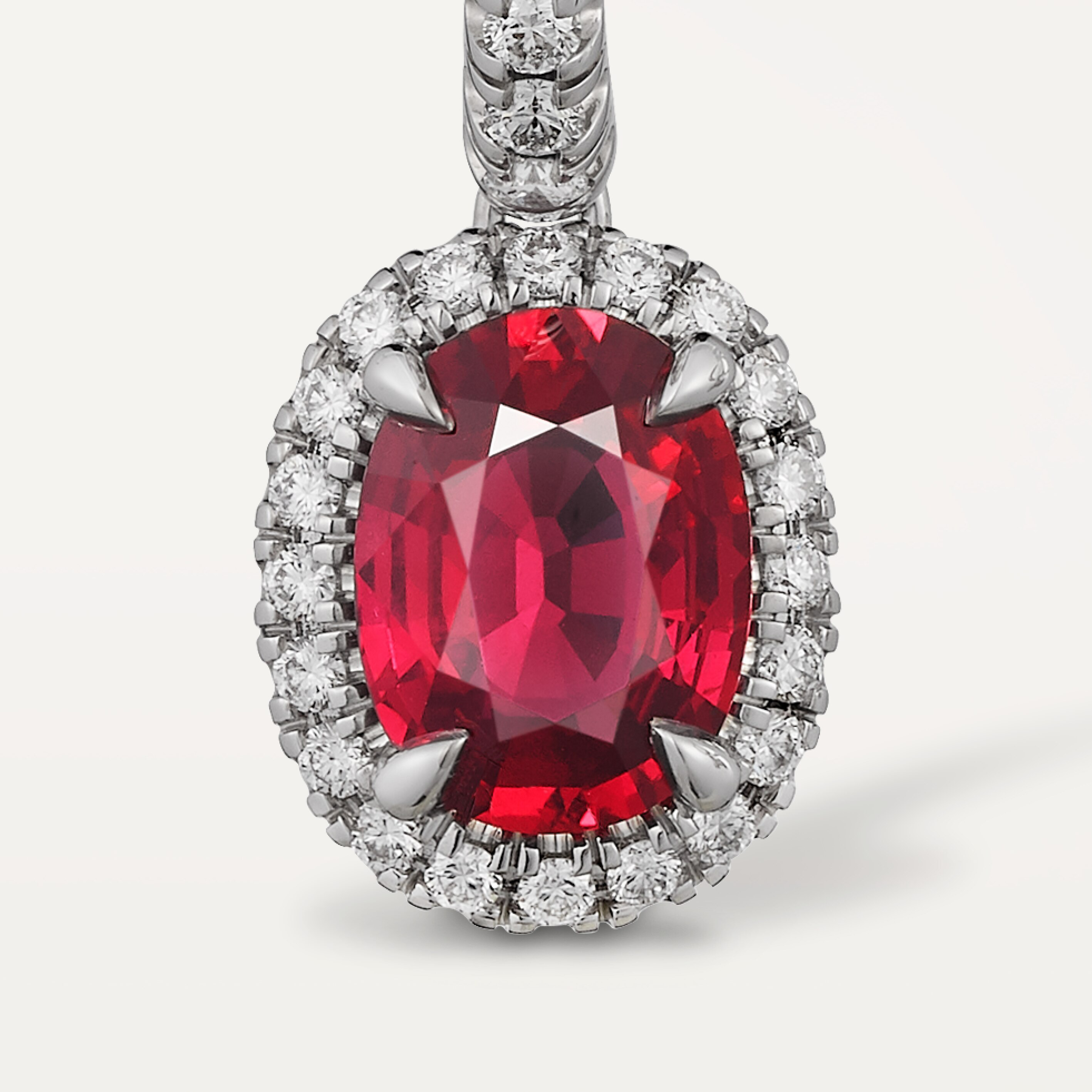 Cartier Destin&eacute;e sleeper earrings, 2 oval-cut rubies, paved
